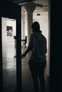 Guy at door inside building