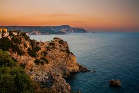 cliffs overlooking the sunset over the sea