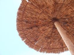 large umbrella on the beach in the sun
