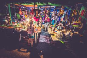 child girl in front of Market stall with souvenirs