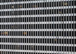 photo of the facade of an office building with many windows