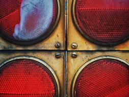 red traffic light with gold