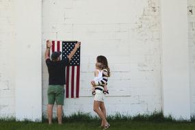 Family American flag on a white wall