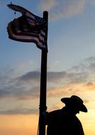 silhouette of a man against the clouds