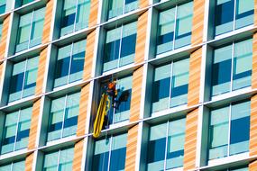 window washer on the facade of a skyscraper