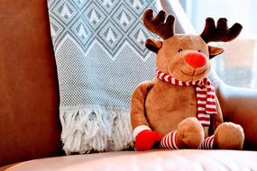 plush deer in a chair