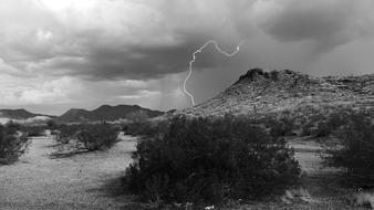 thunderstorm in desert in black and white background