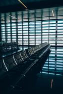 Waiting area in shadow with windows in an airport