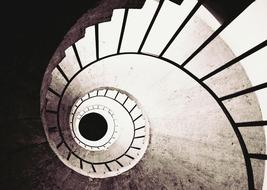 black and white photo of a spiral staircase