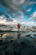 Guy in red in a picturesque landscape