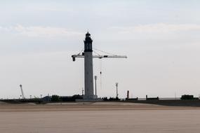 Lighthouse Crane on Sand beach
