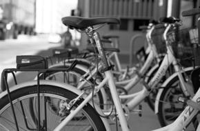 bicycle parking in the city in black white blurred background