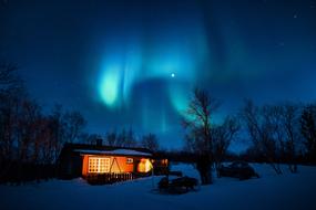 Landscape on the northern lights over the house