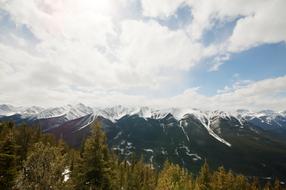white clouds over the mountain