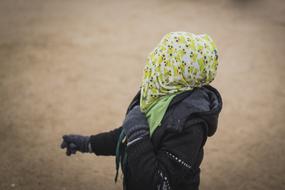 man in scarf and gloves