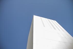 white high-rise building against blue sky