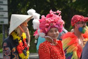 happy people in colorful clothing on parade for Christopher Street day, germany, hamburg