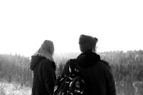 Guy and Girl in winter clothing, back view