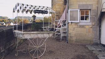 metal chariot near the house