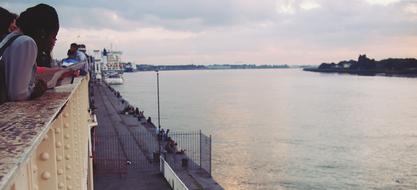 tourists at the docks at dusk