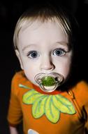 Child with a pacifier, portrait