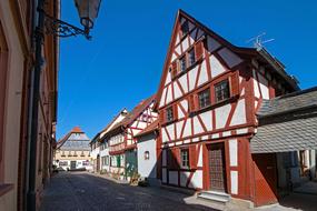 Beautiful and colorful, vintage houses in Seligenstadt, Germany, under the blue sky