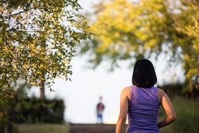 girl in the park close-up on a blurred background