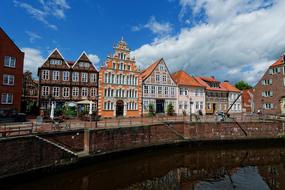 Beautiful and colorful houses, in the port of Stade, Germany, under the blue sky with clouds