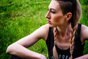 photo of a strong girl with two pigtails