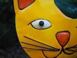 yellow metal cat, garden decoration