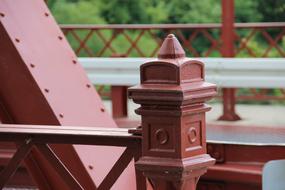 red metal railings on the railway bridge