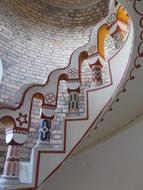 Beautiful and colorful, ornamental, spiral staircase in the castle in SzÃ©kesfehÃ©rvÃ¡r, Hungary