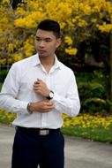 photo of asian man in summer park