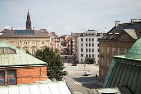 Old and beautiful buildings and green tree in Copenhagen, Denmark