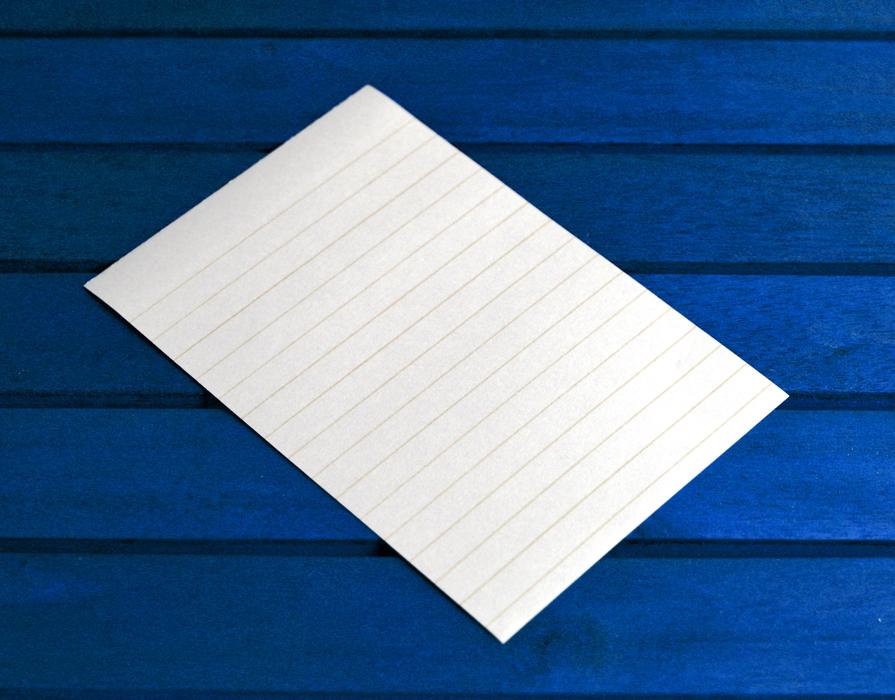 white paper on a blue background