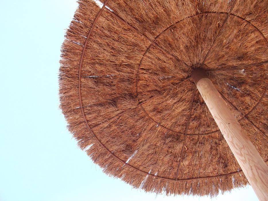 large umbrella on the beach in the sun
