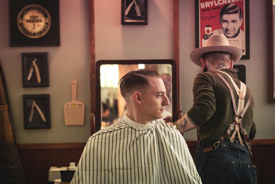 two men in vintage interior of Barbershop