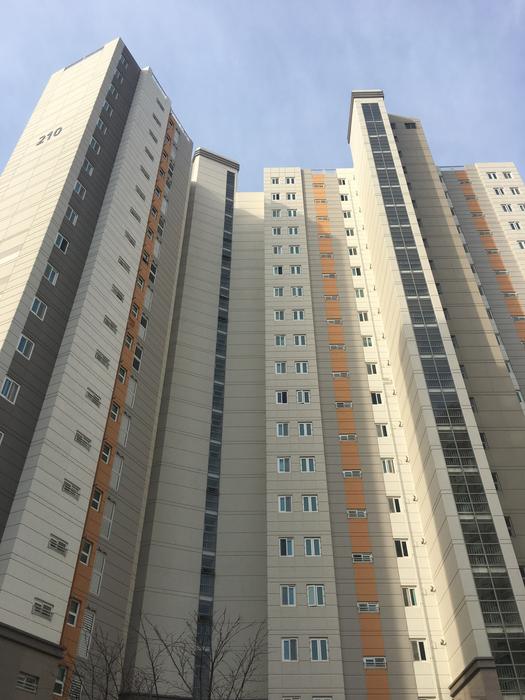 a large apartment building against the sky