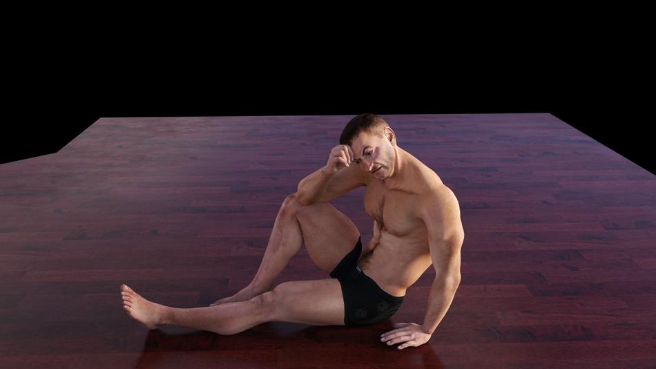 thoughtful muscular man sits on floor