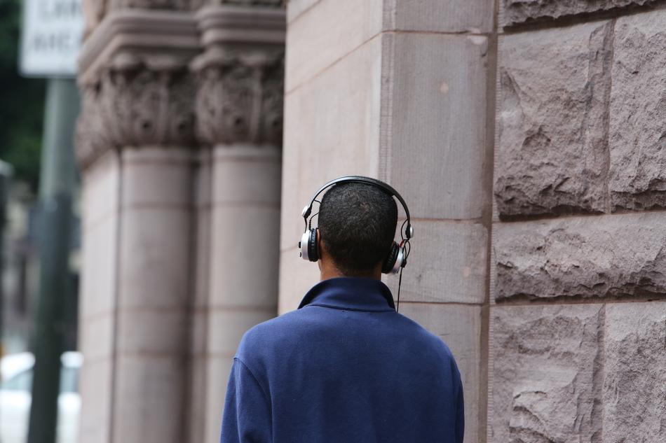 Guy with headphones in city
