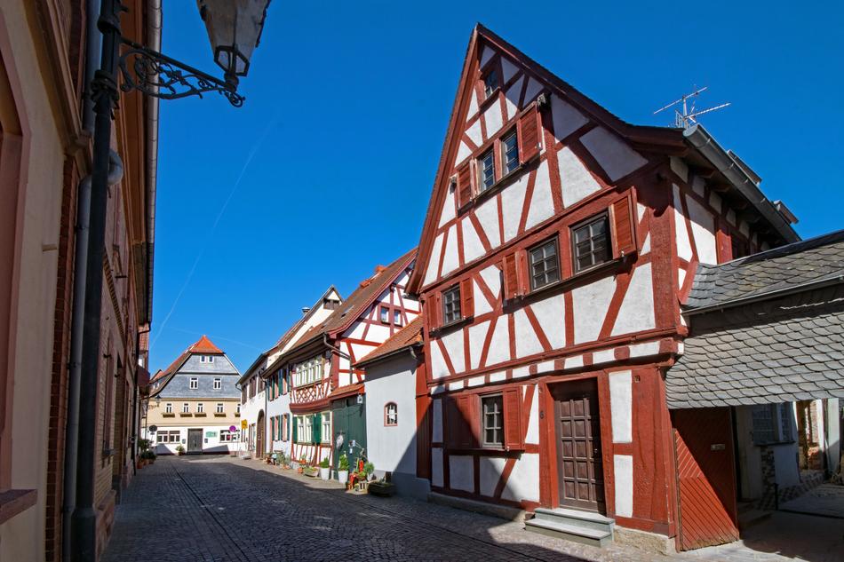 Beautiful and colorful, vintage houses in Seligenstadt, Germany, under the blue sky