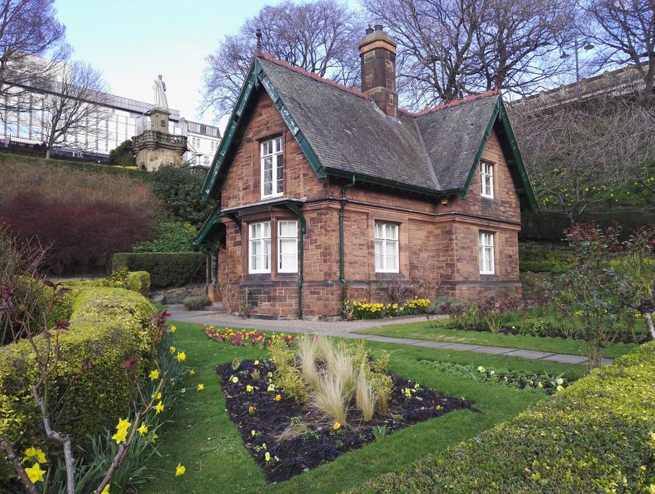 a park with a brick house