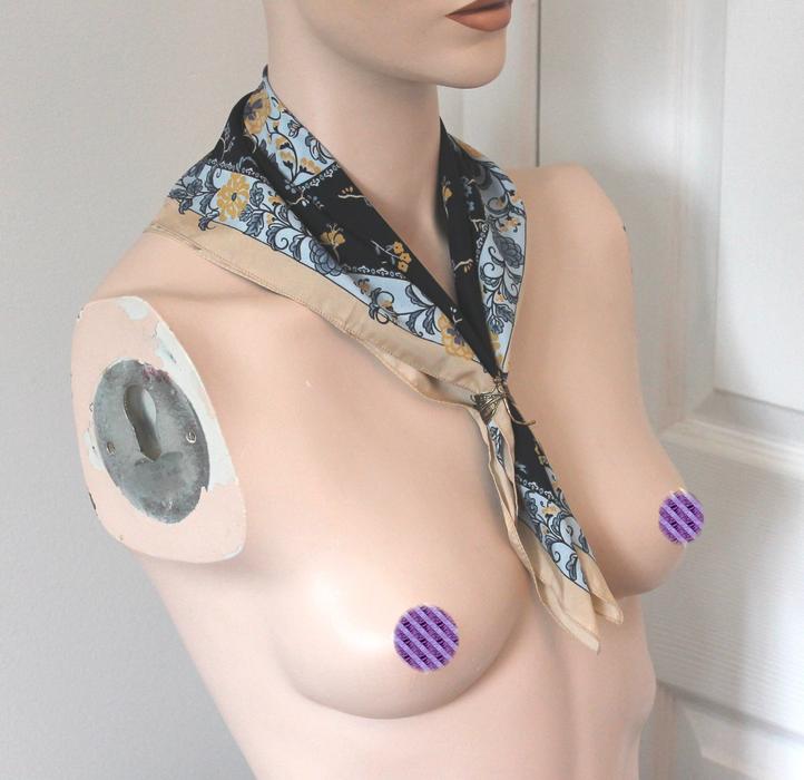 mannequin with a scarf around his neck