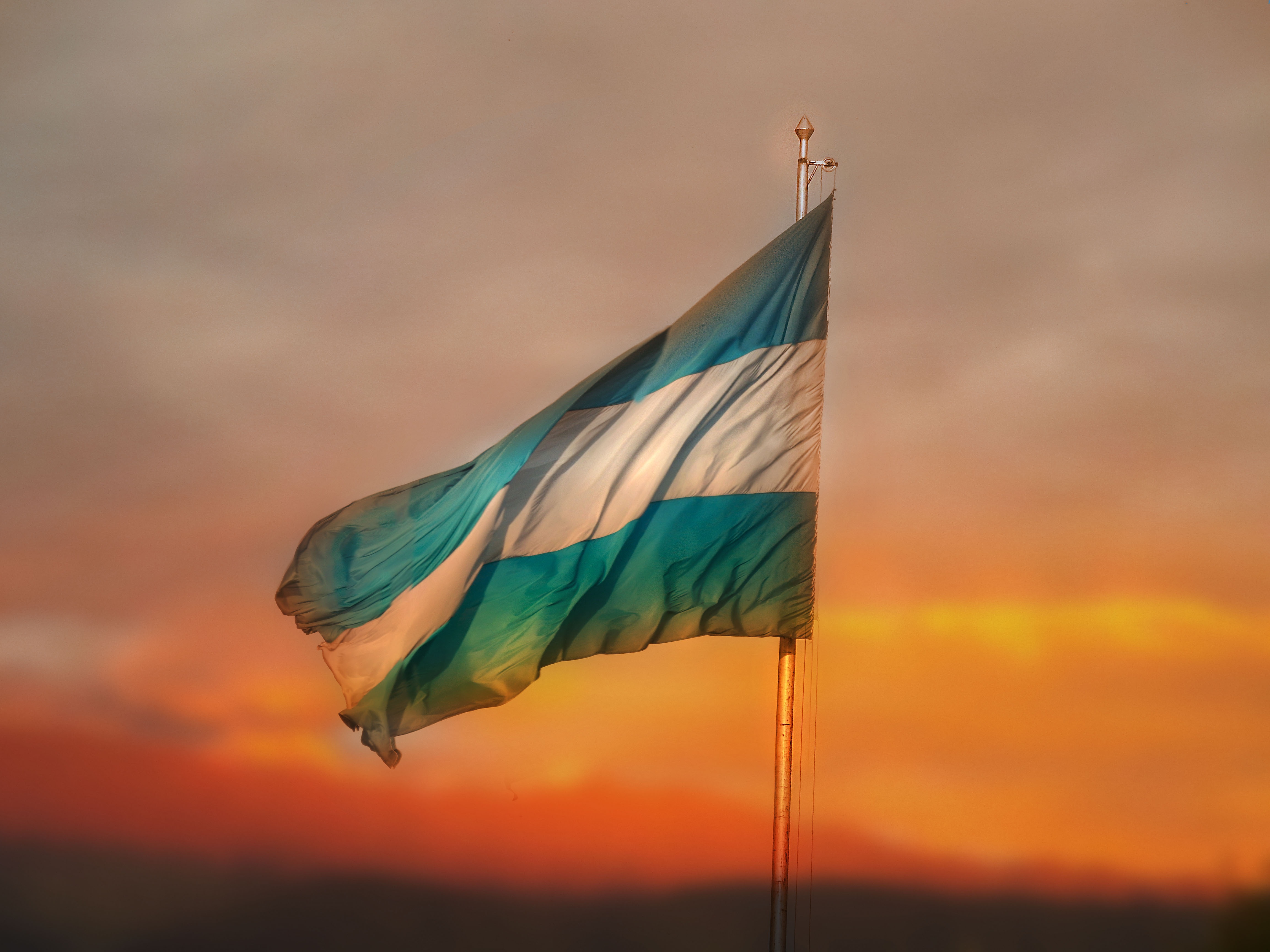 beautiful-wavy-flag-of-argentina-at-colorful-sunset-free-image-download