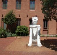 white sculpture with a building