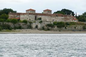 a large castle with rocks