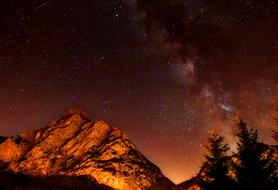 milky way over mountains in italy