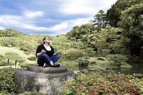 girl sitting nature meditation