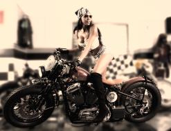 elegant girl posing on a motorcycle