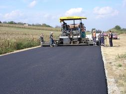 Paving Workers and Machines